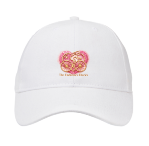 White peaked cap with the pink and gold Endurance Diaries heart logo.